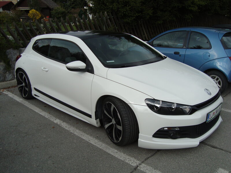 white car in parking lot