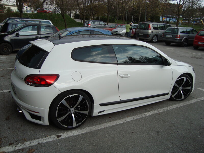 white car in parking lot