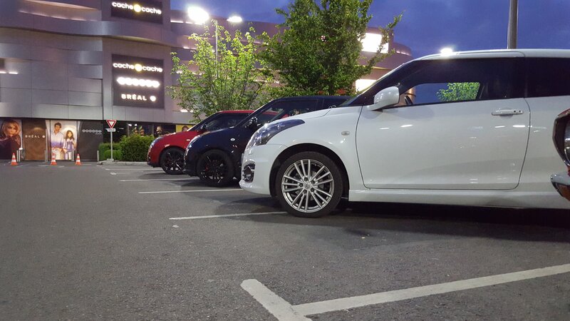 White Car in Parking Lot — Calm