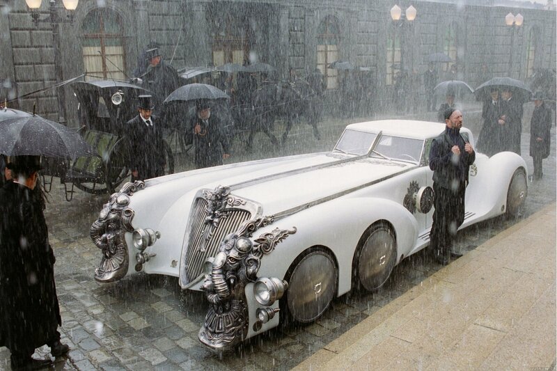 White car in rainy city