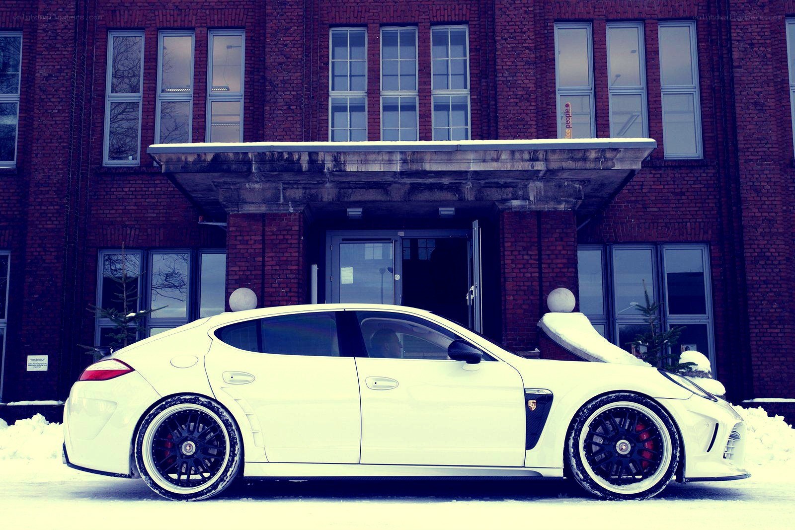 White car in snowy city