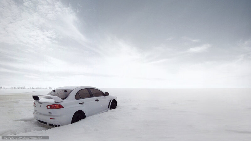 White car in snowy landscape
