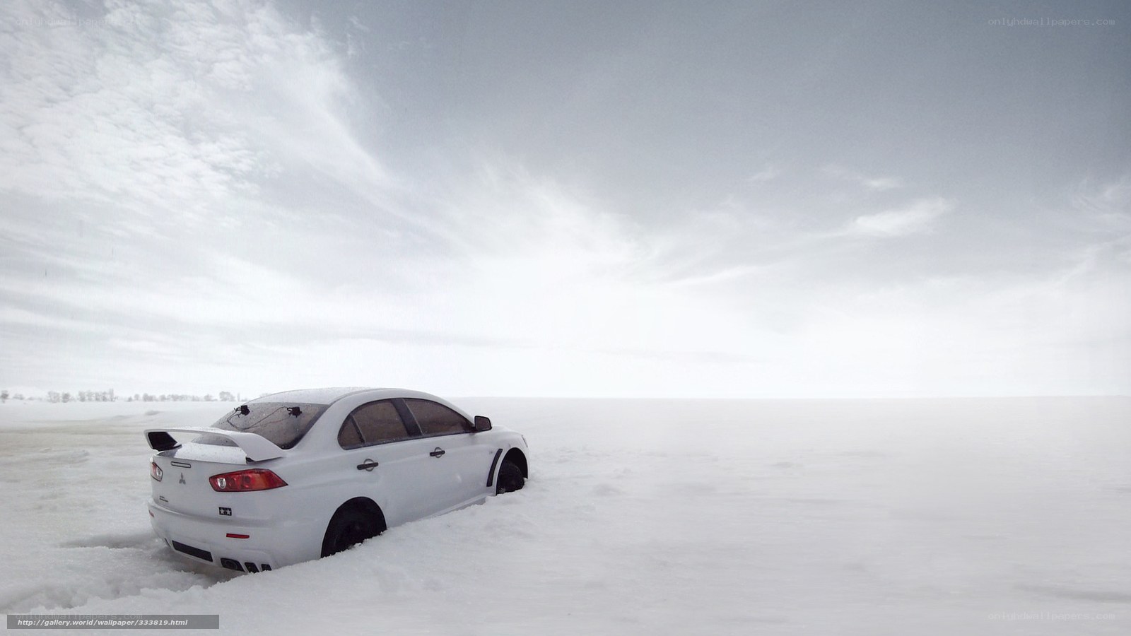 White car in snowy landscape