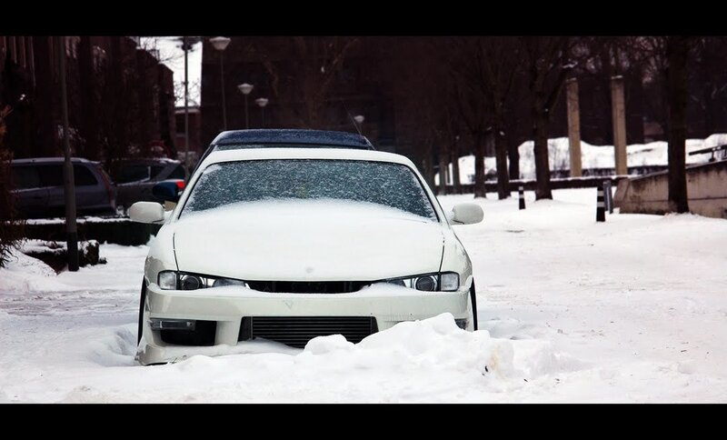 White car in snowy street