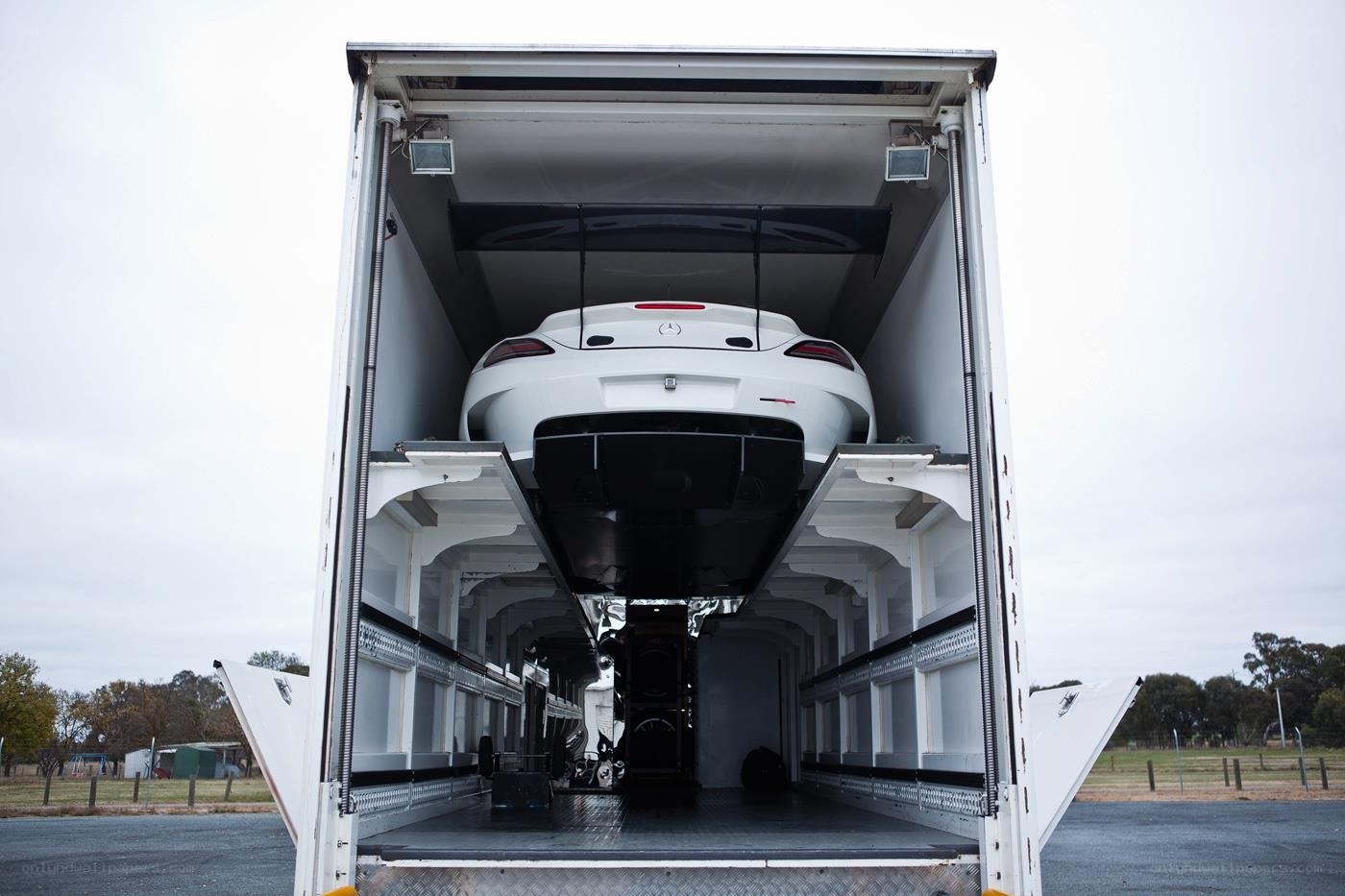 White car in transport trailer