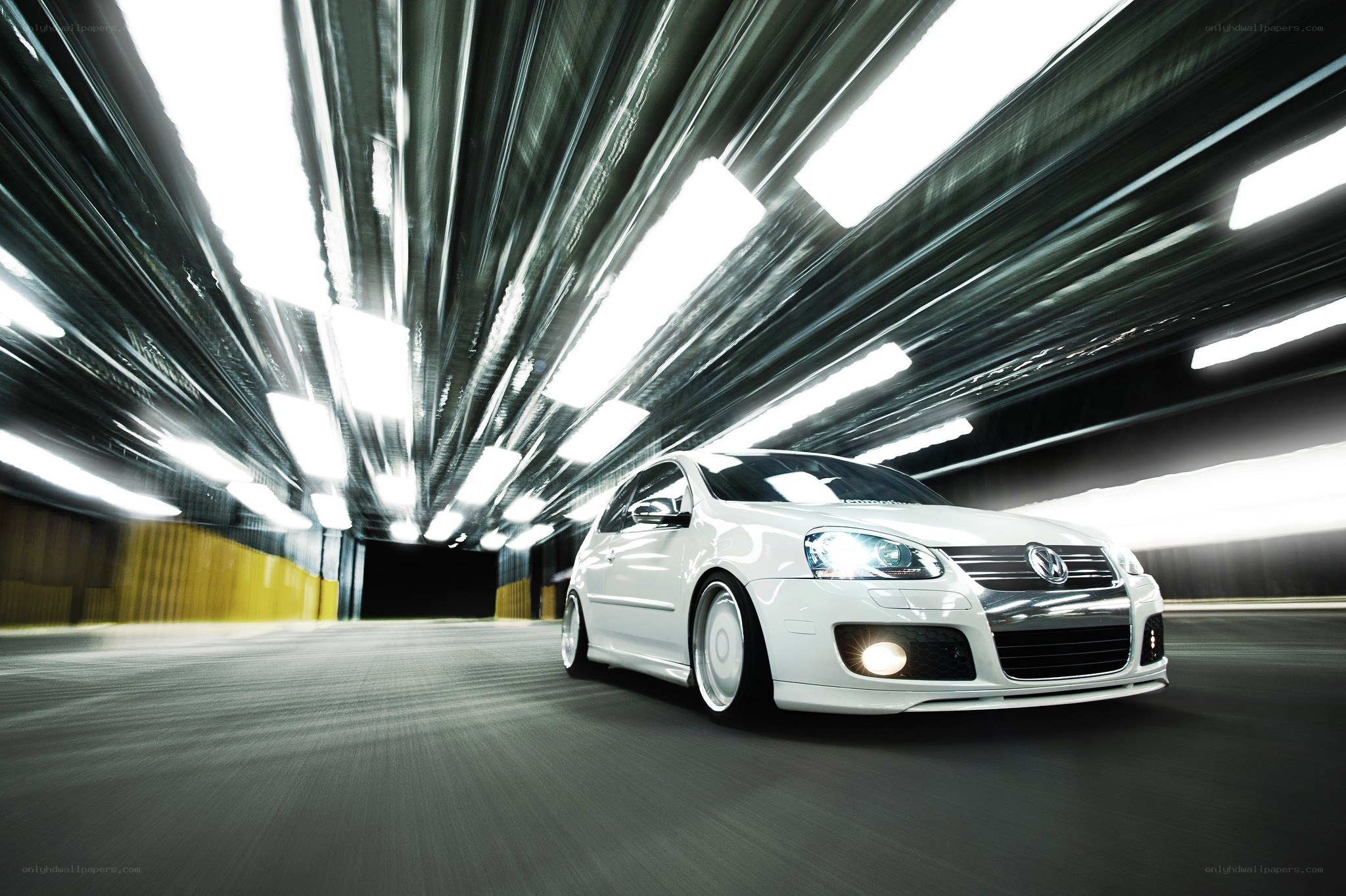 white car in tunnel motion