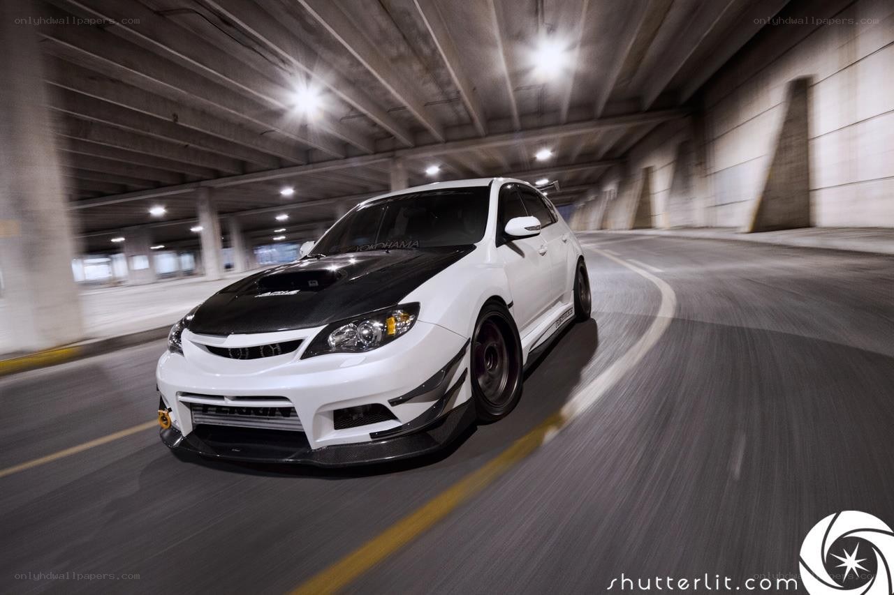 white car in tunnel