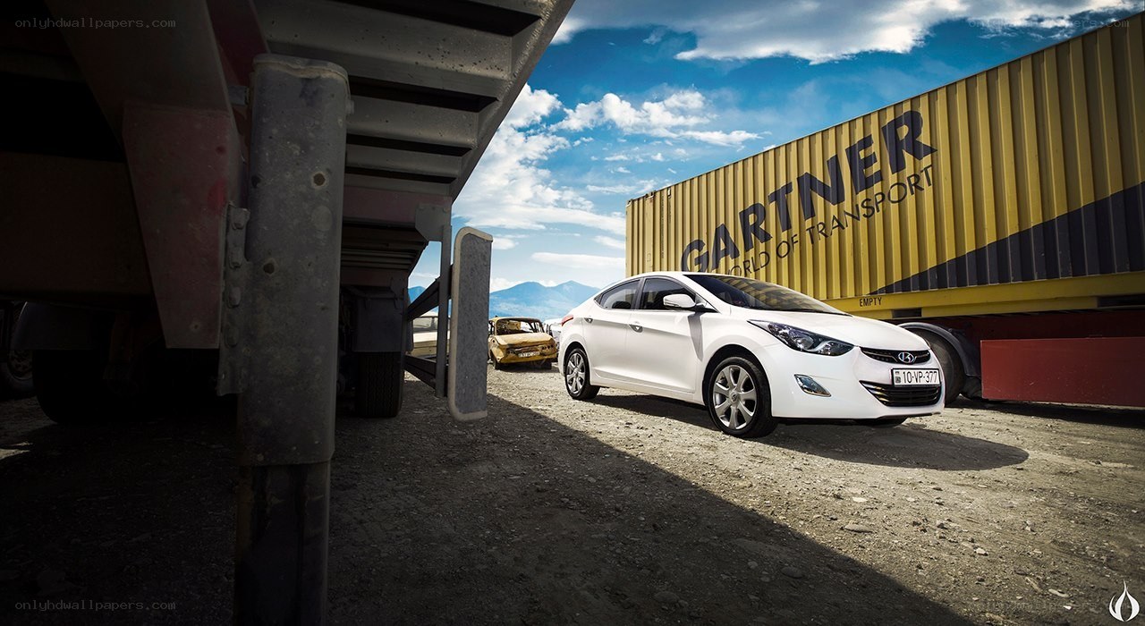 White car near shipping container