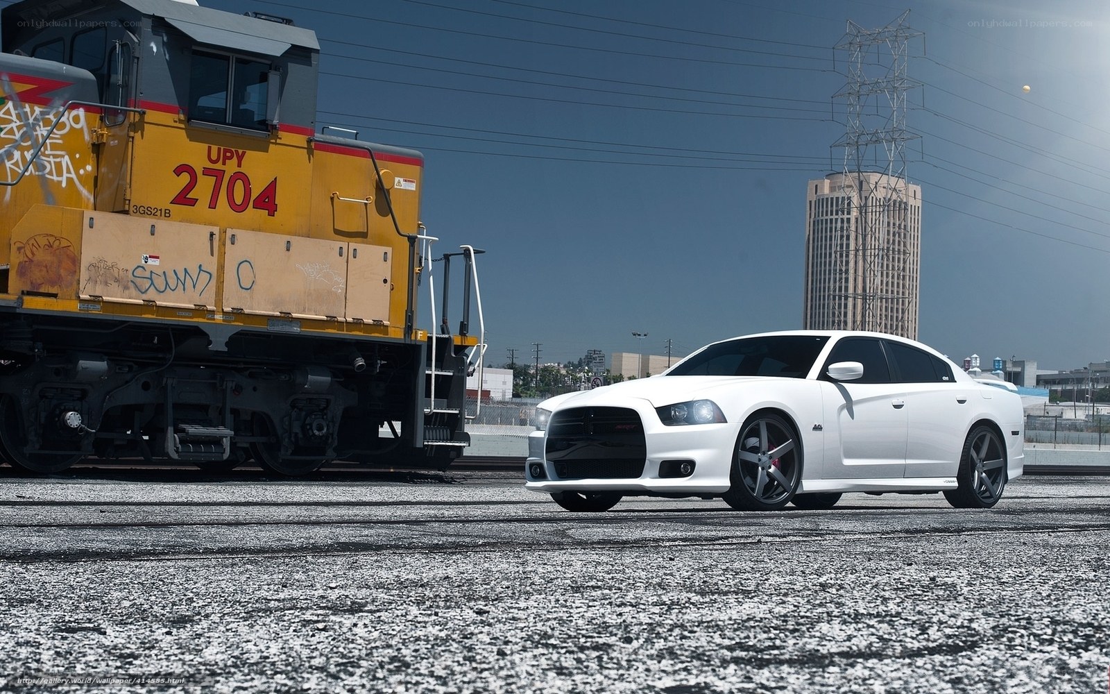 White car next to train