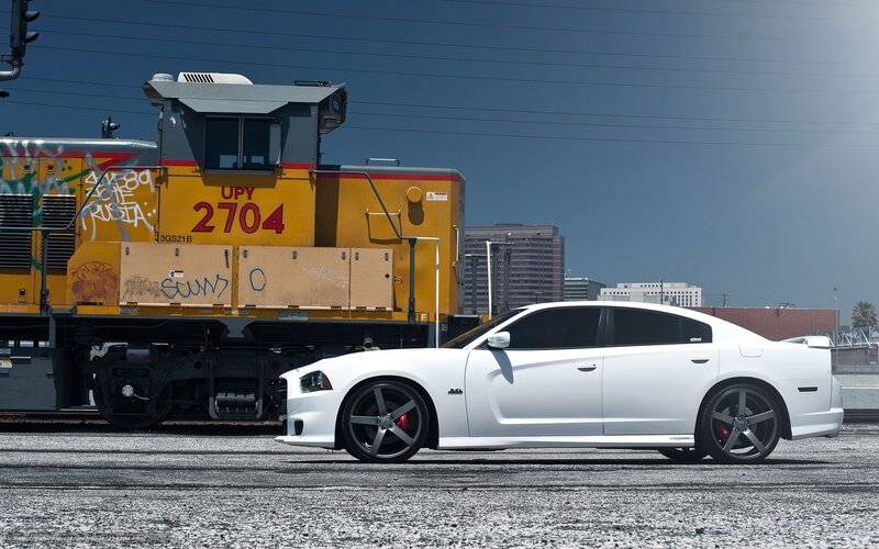 White car next to train