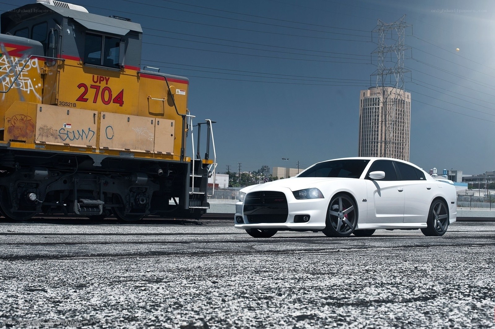 White car next to train