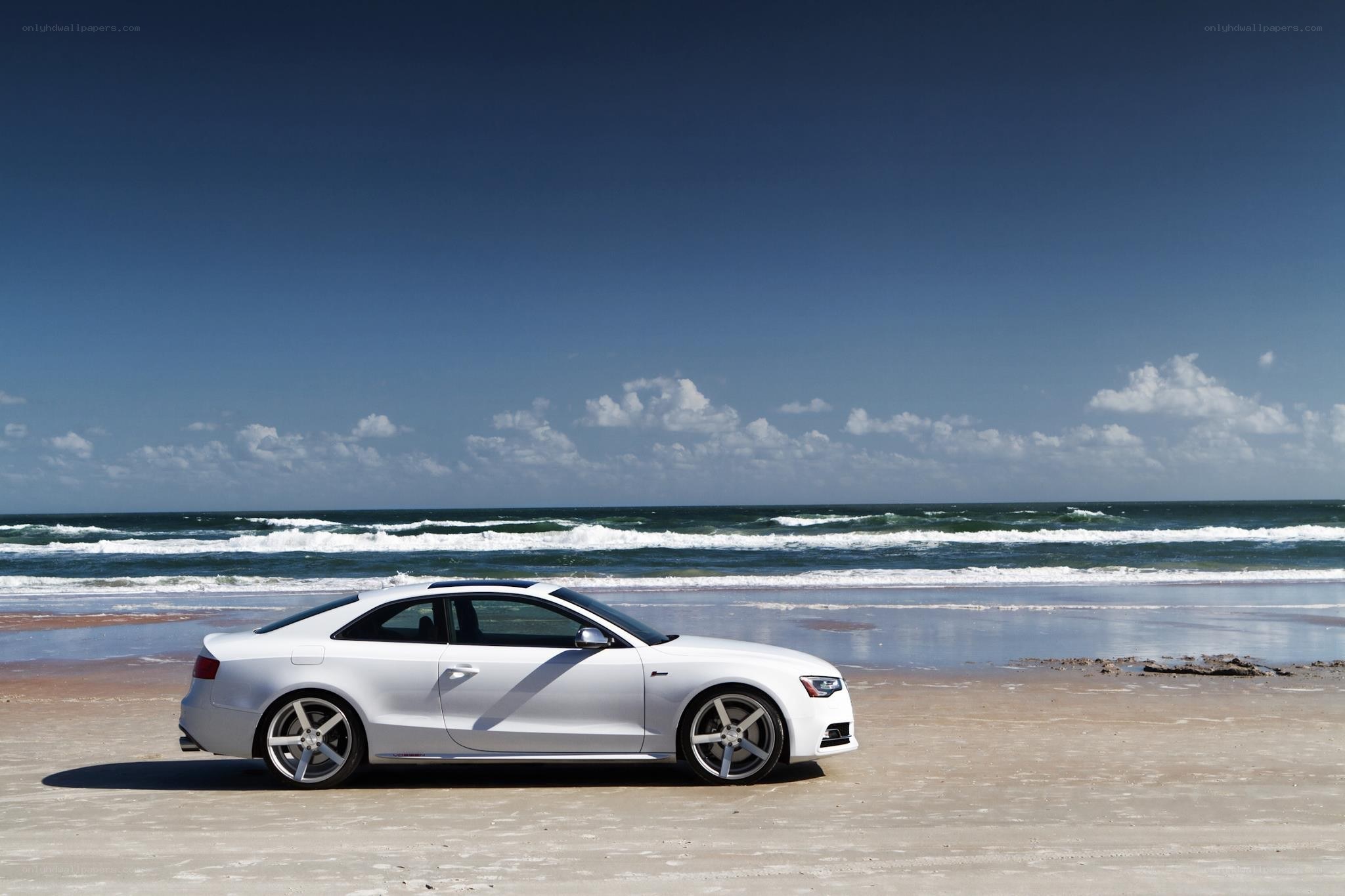 White car on a beach