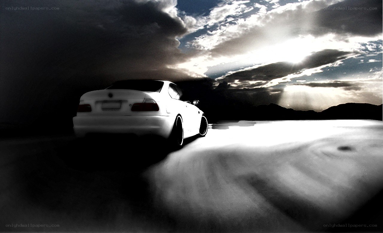 White car on a dark road