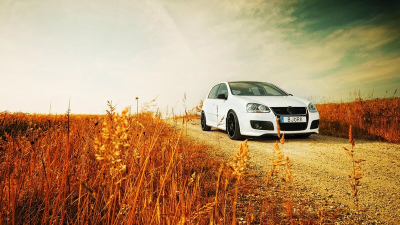 White car on a dirt road
