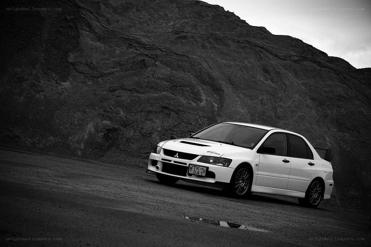 White car on a dirt road