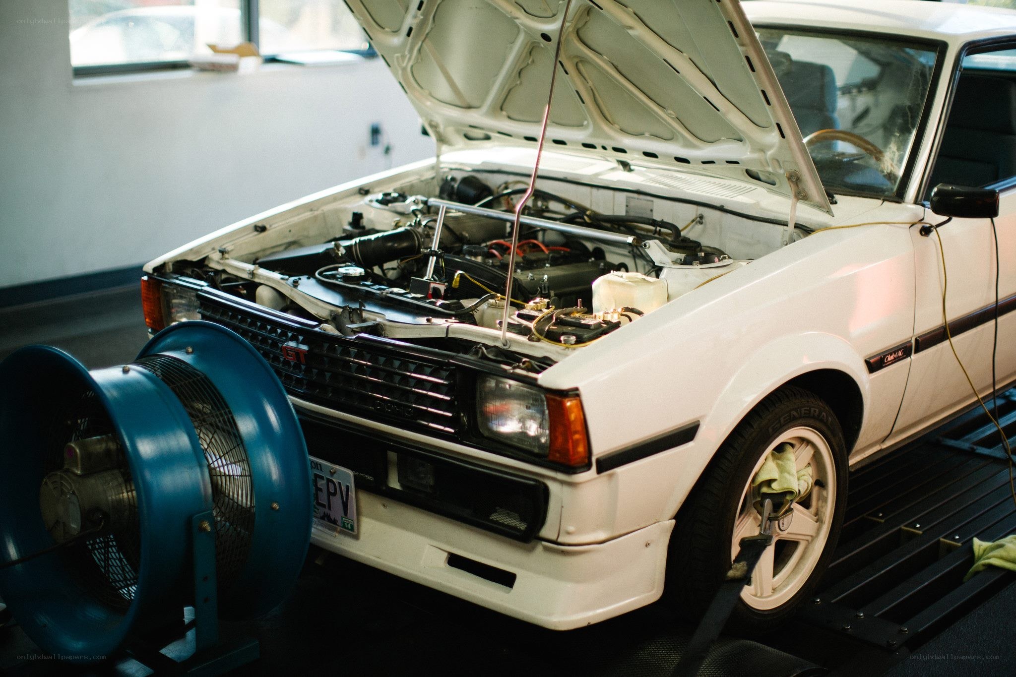 white car on a dynamometer