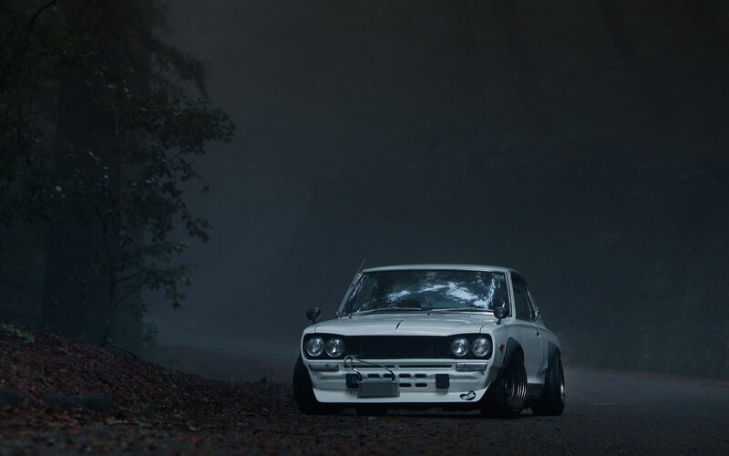 White car on a foggy road
