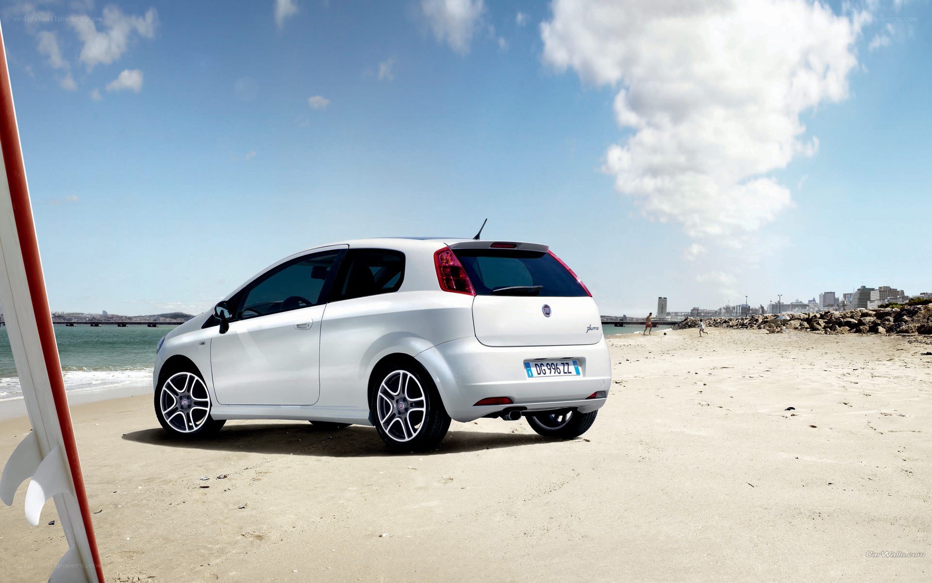 White car on a sunny beach