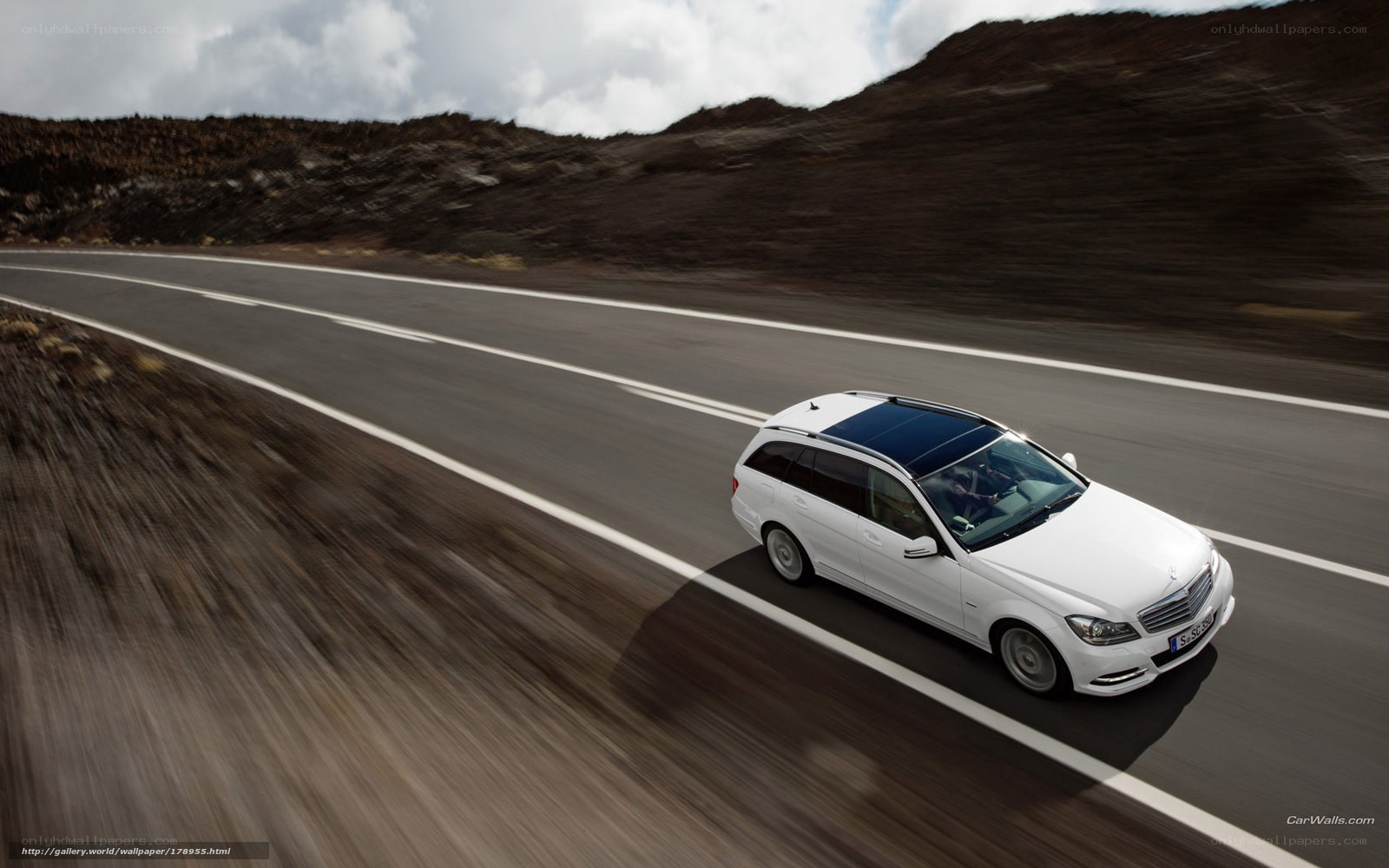 White car on a winding road