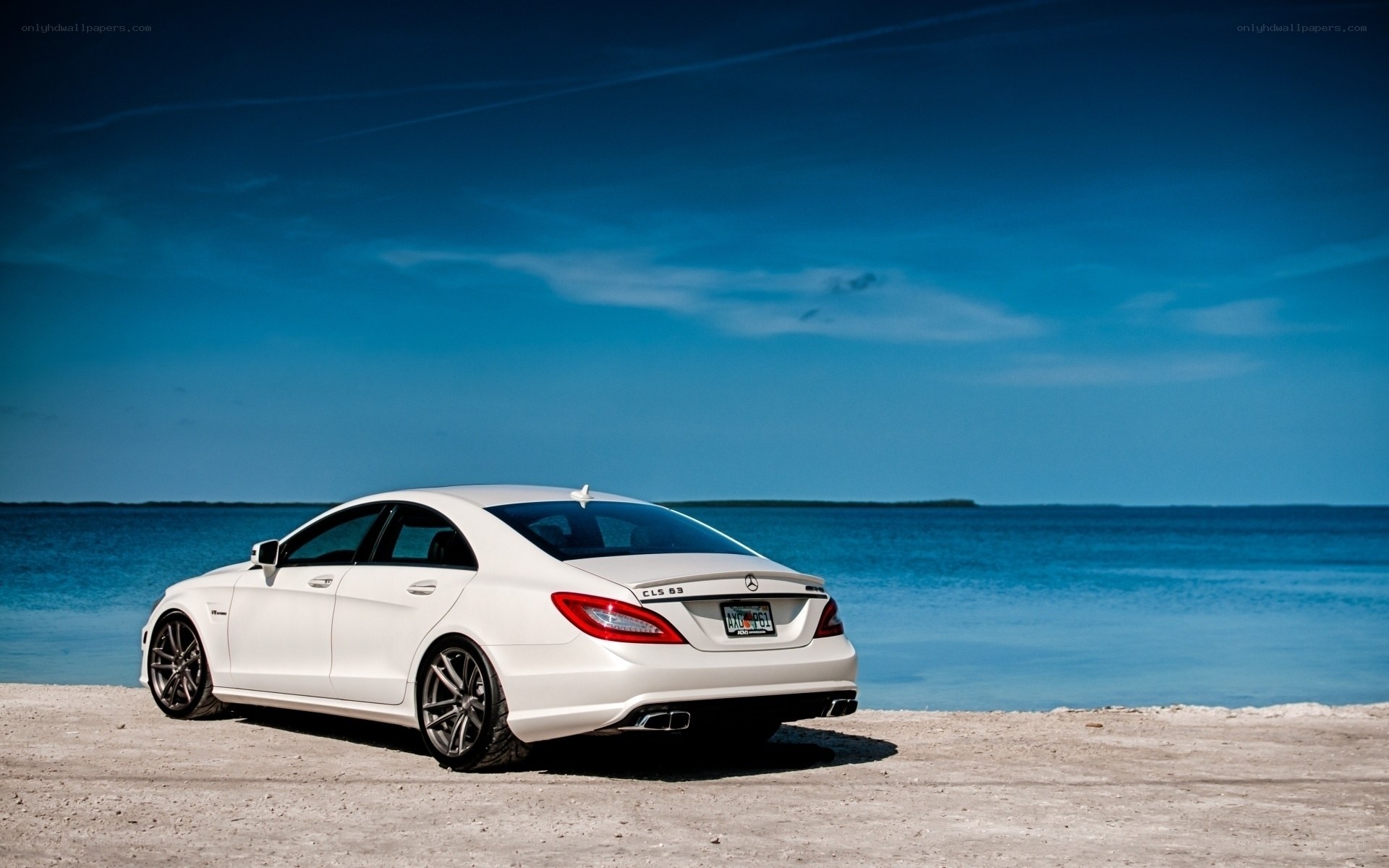 White car on beach