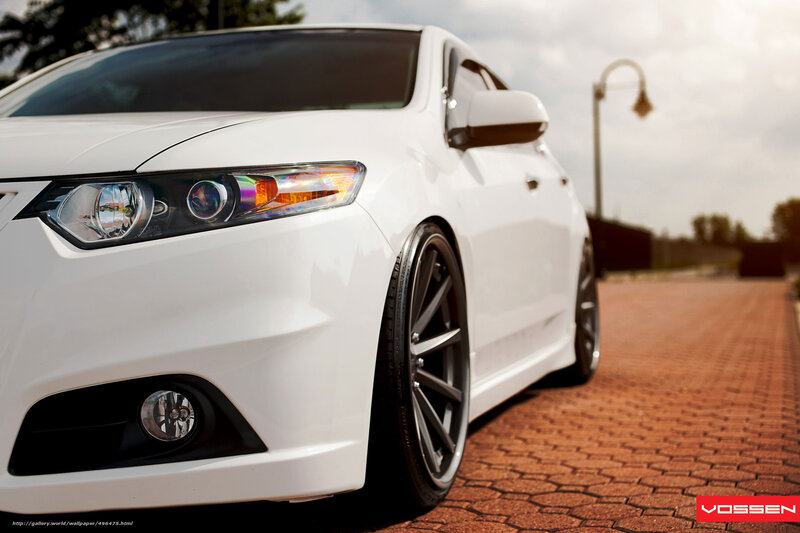 white car on brick pavement
