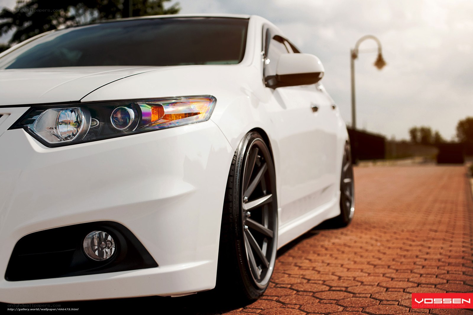white car on brick pavement