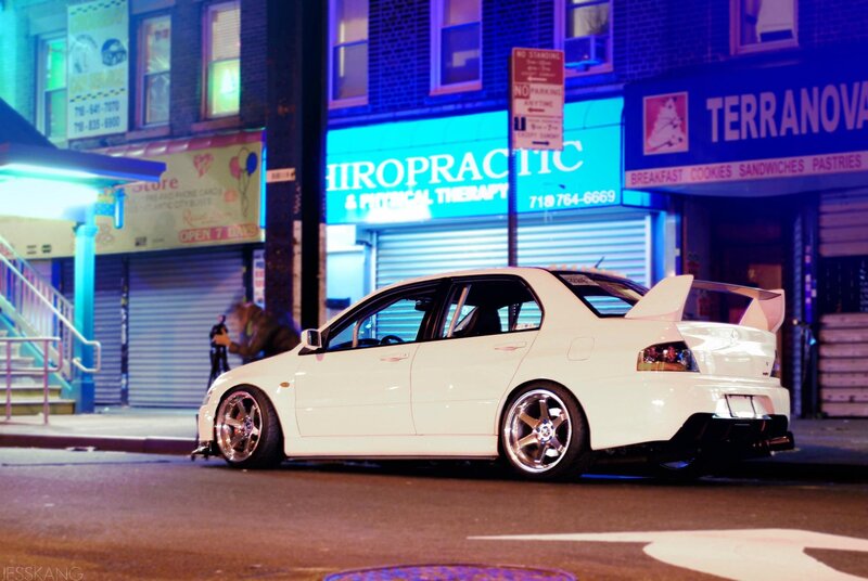 white car on city street at night