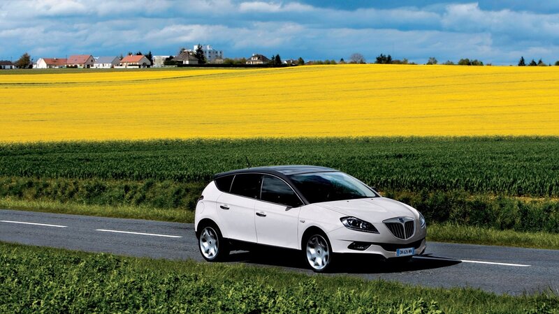 White car on country road