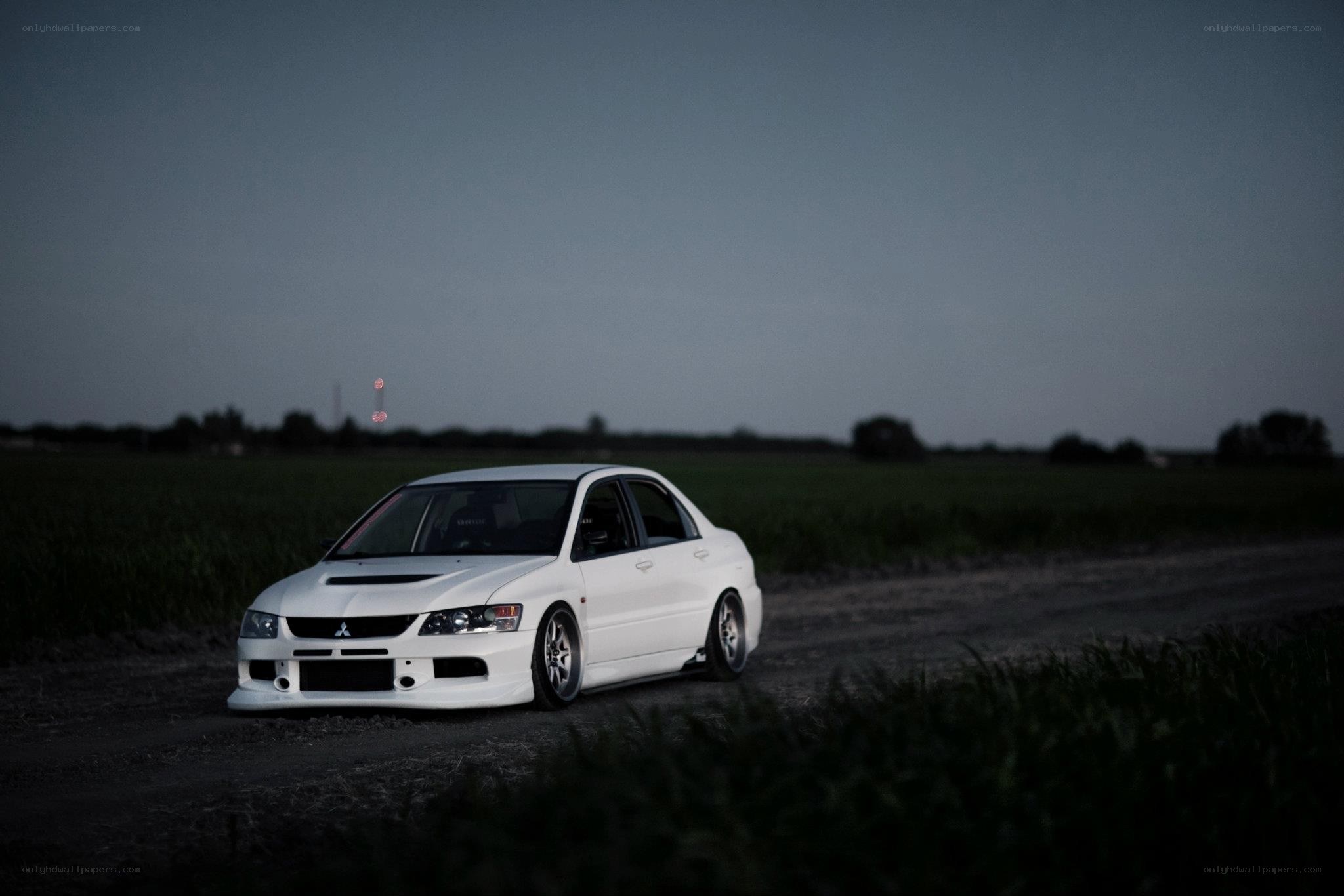 white car on dirt road