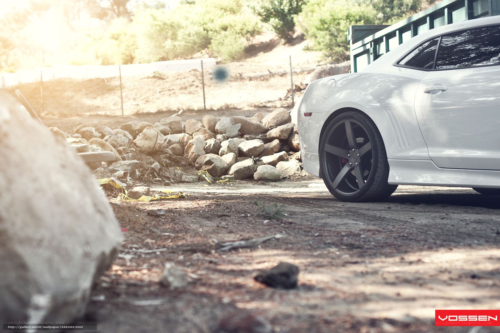 white car on dirt road
