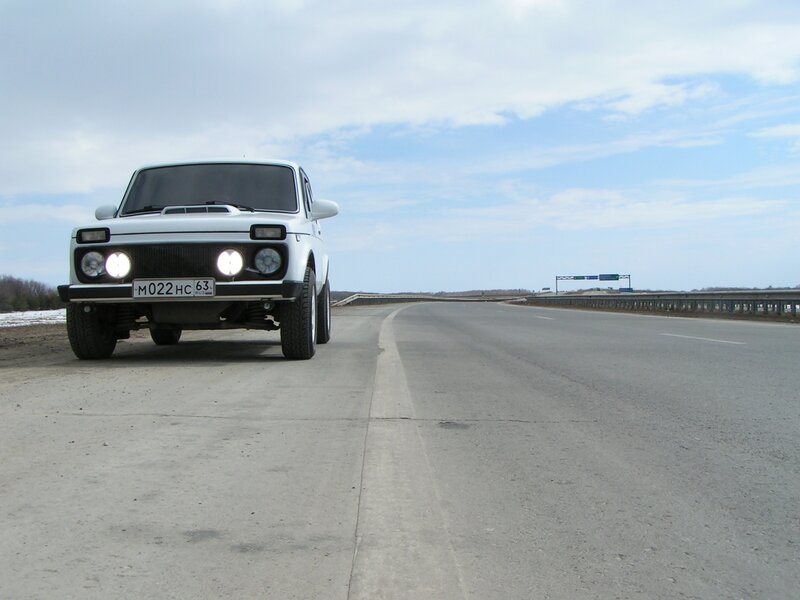 White car on empty road