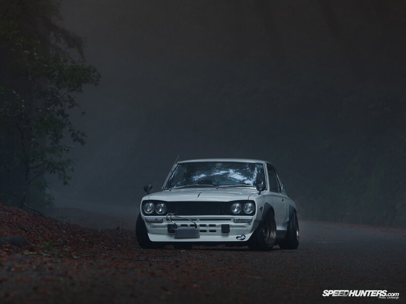 White car on foggy road