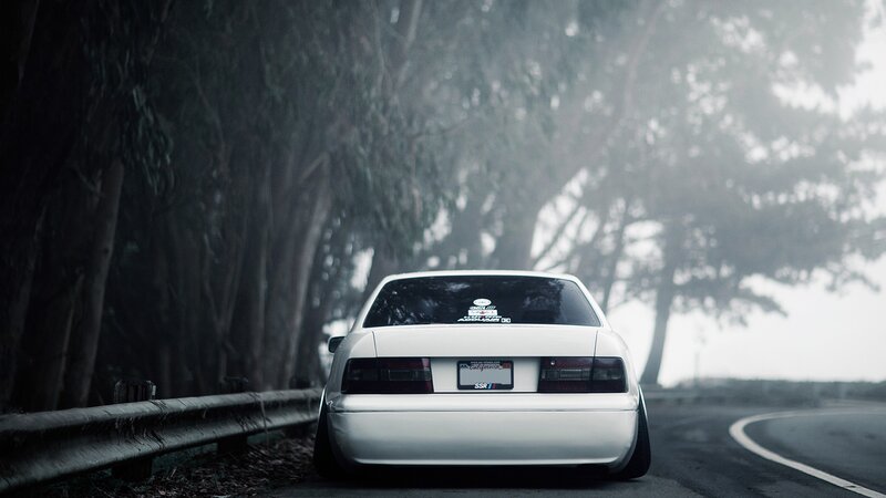 white car on foggy road