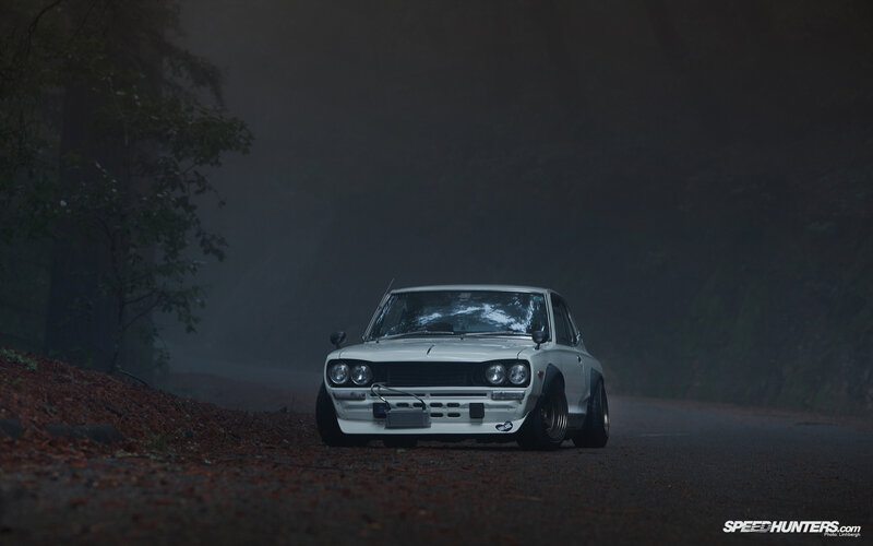 White car on foggy road