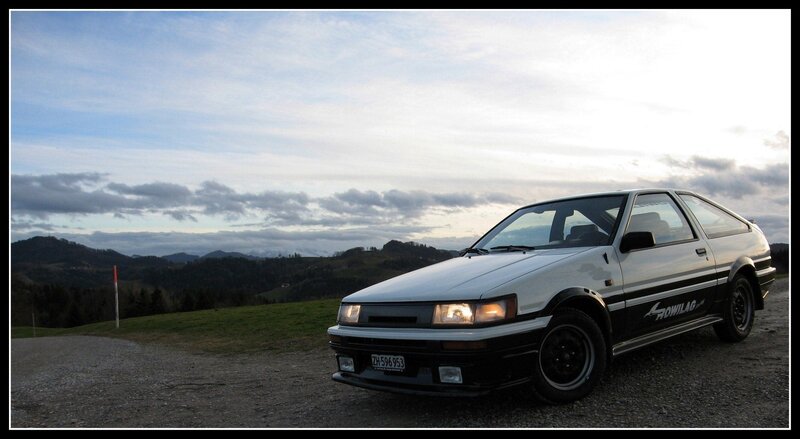 white car on gravel road