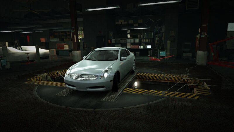 white car on lift in garage