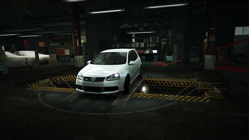 white car on lift in garage
