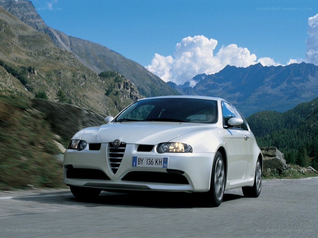 white car on mountain road