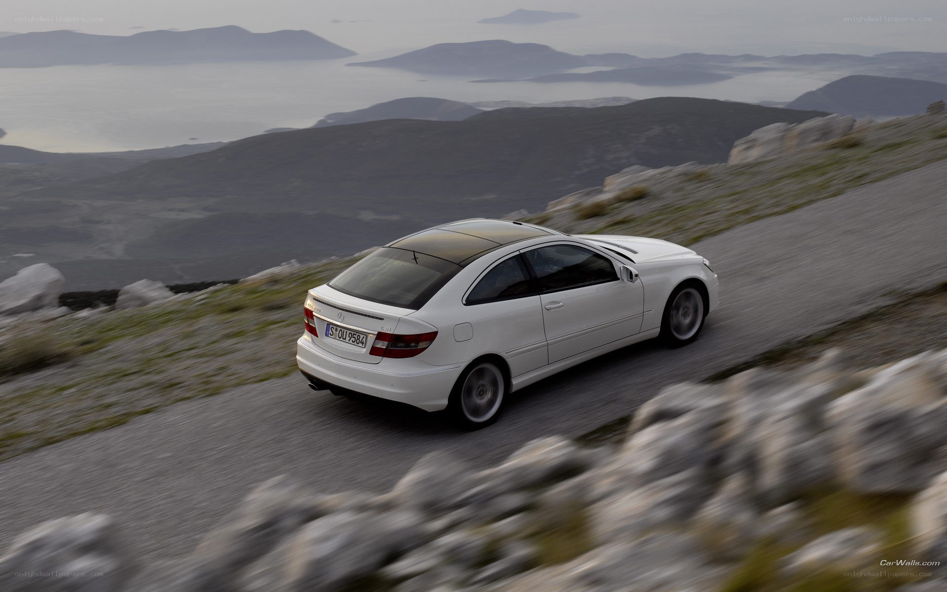 white car on mountain road
