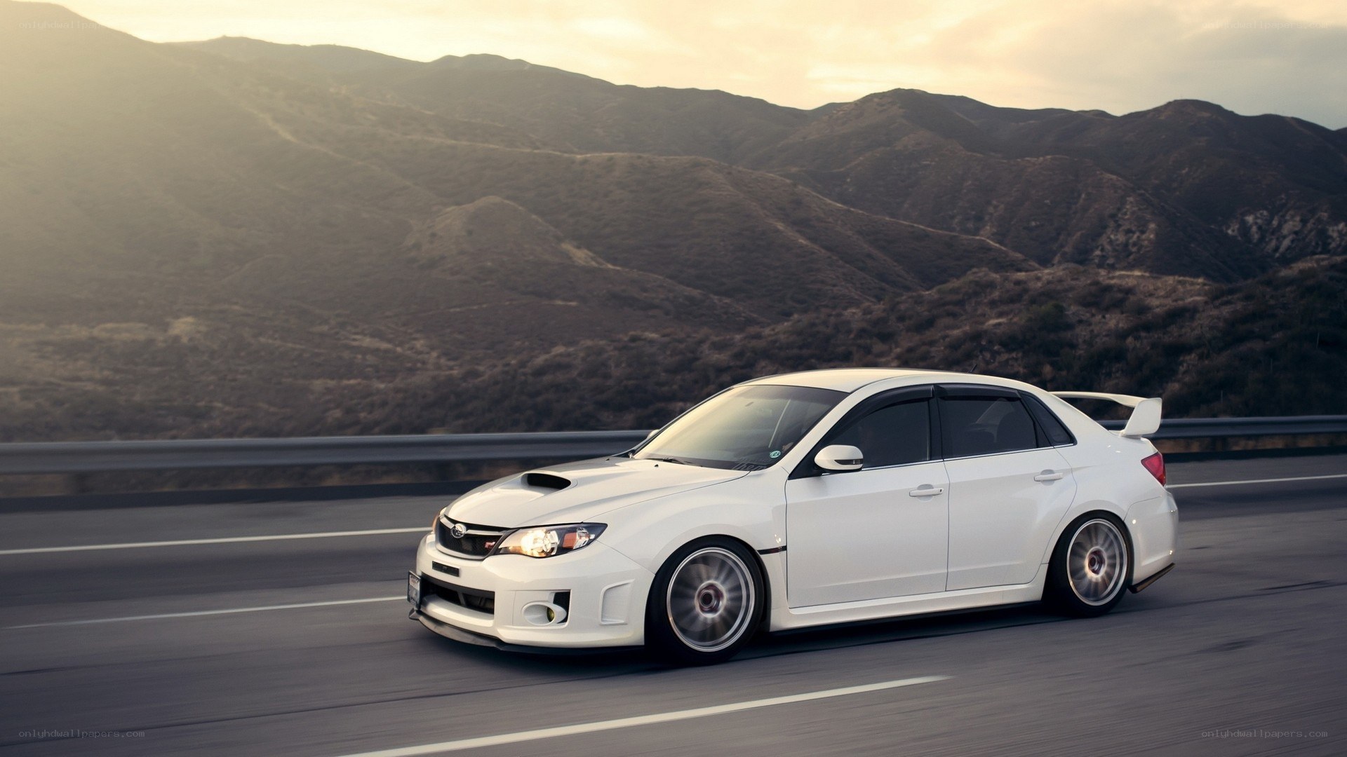 white car on mountain road