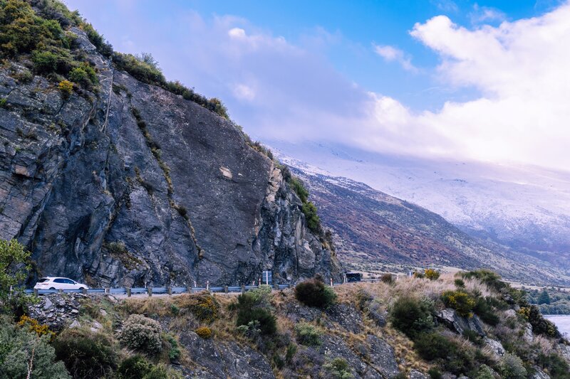 White Car on Mountain Road — Blue