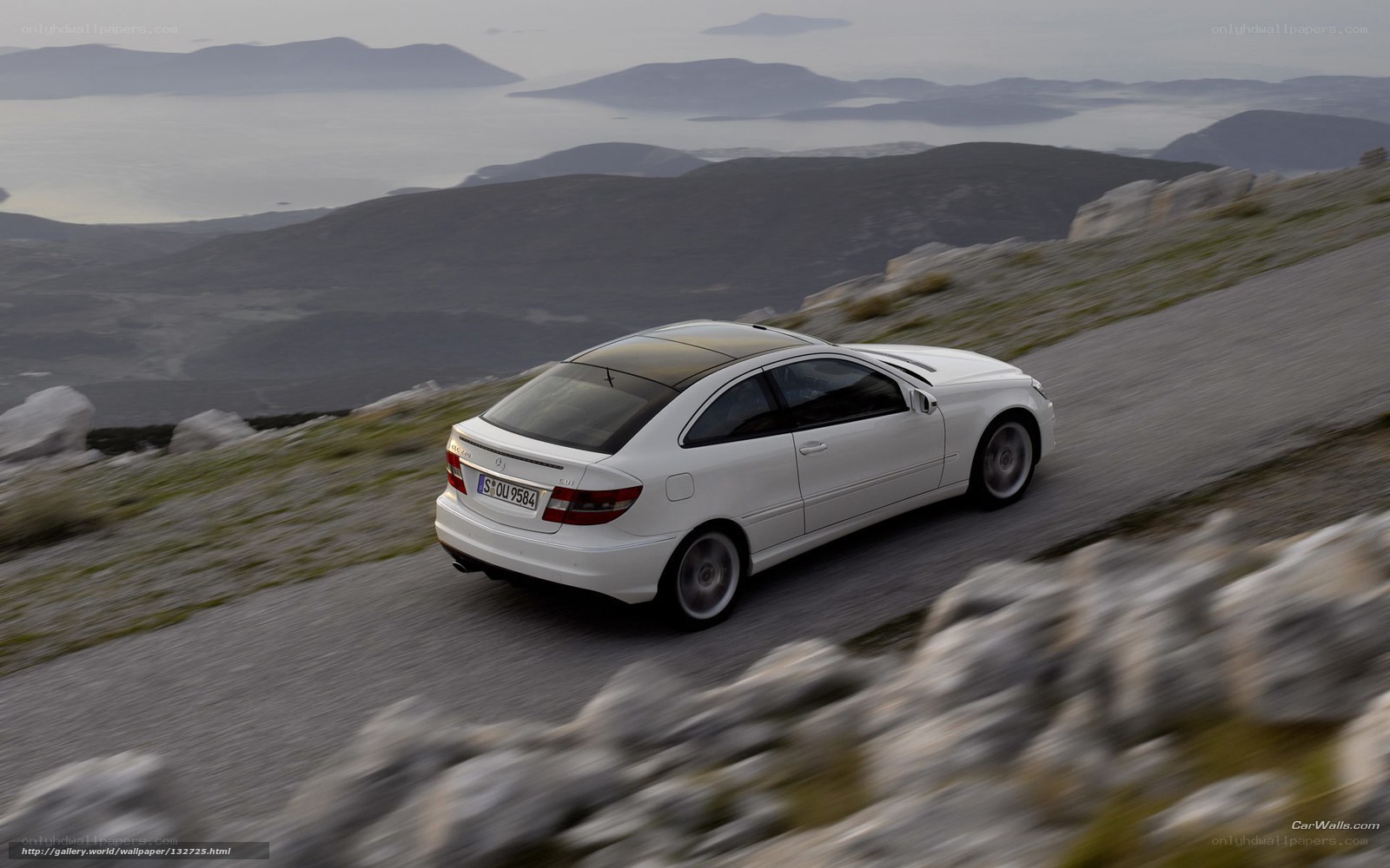 White car on mountain road
