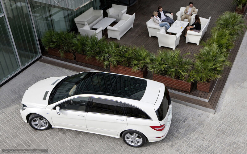 White car on patio with people