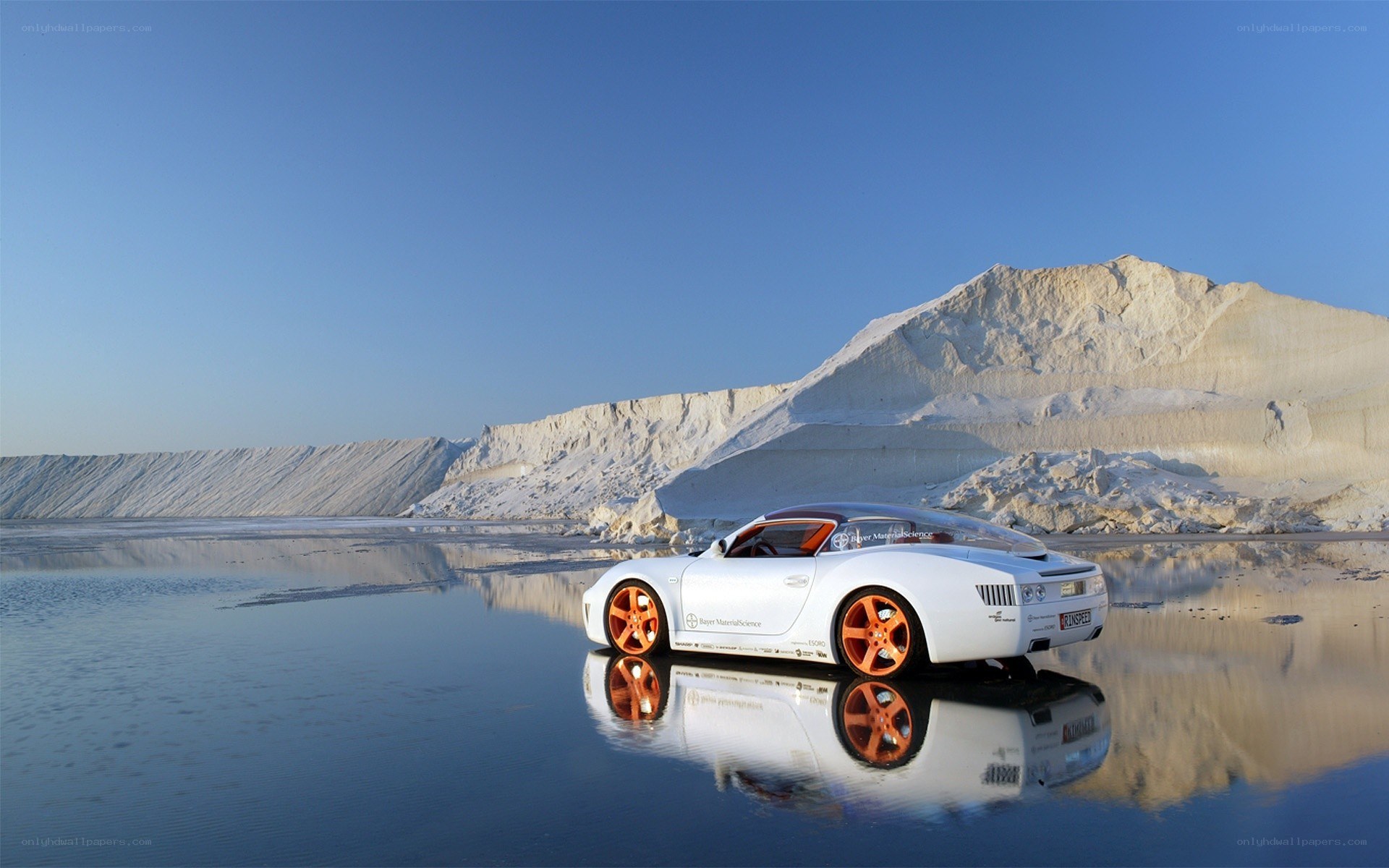 White car on reflective water
