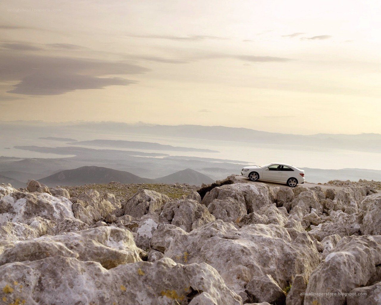 White car on rocky mountain
