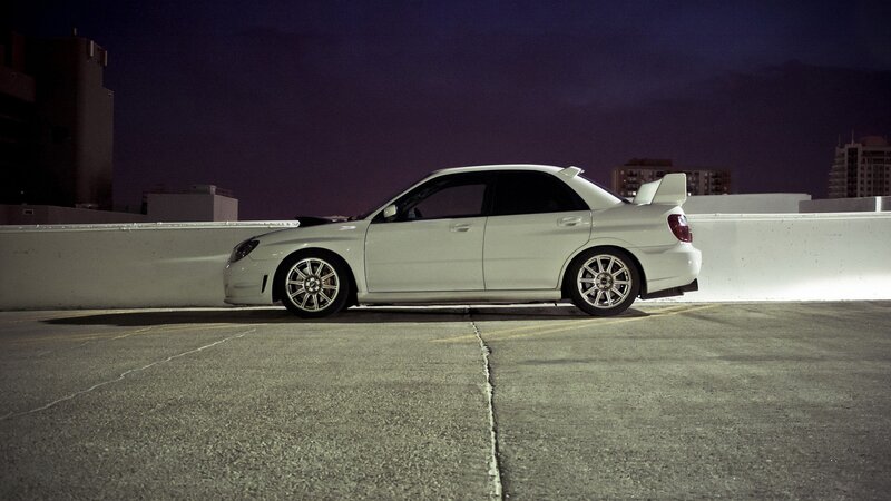 white car on rooftop at night