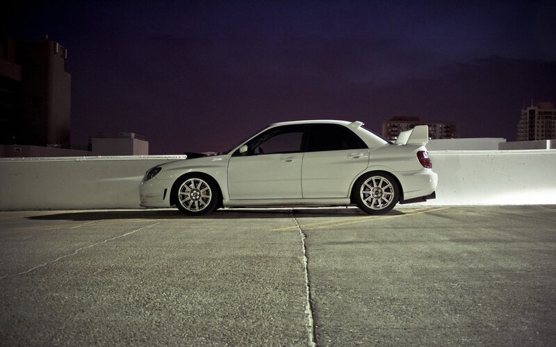 white car on rooftop at night