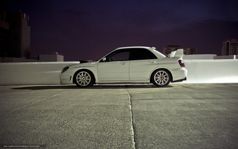 white car on rooftop at night