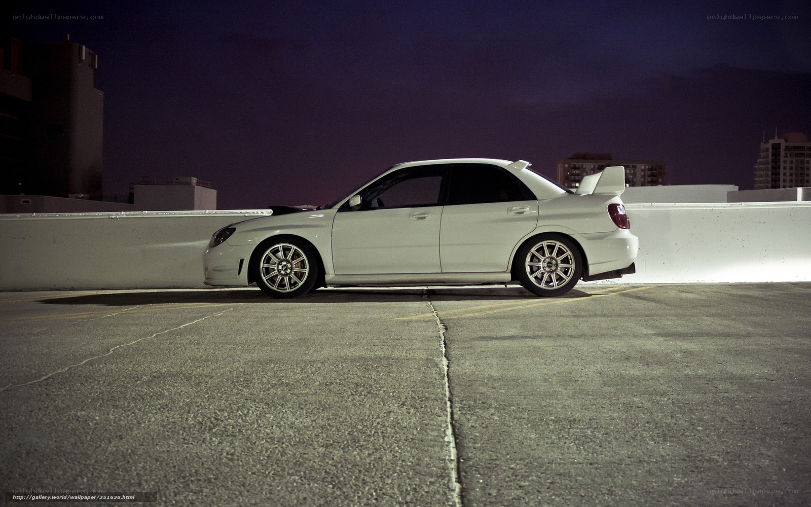 white car on rooftop at night