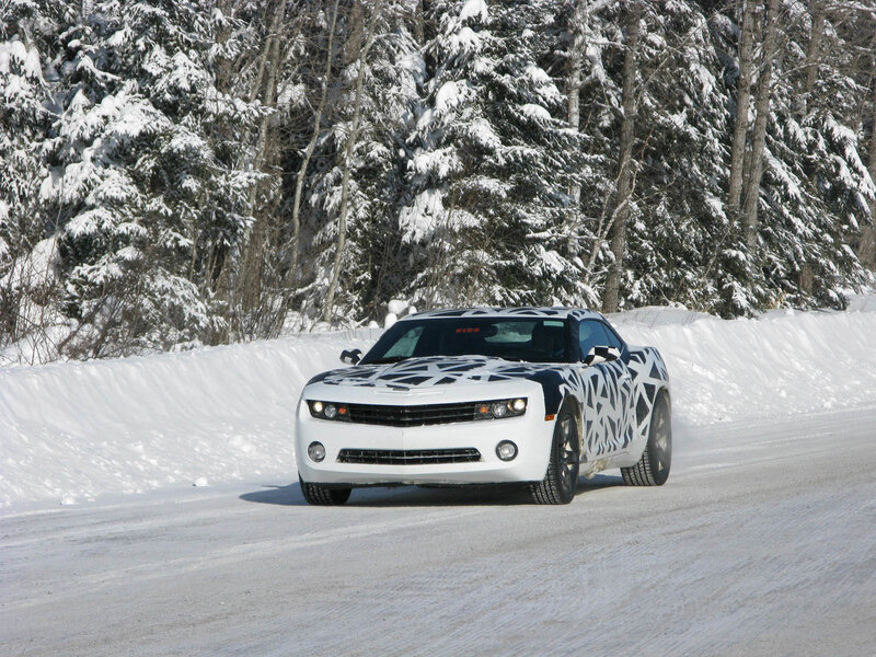 White car on snowy road
